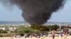Dark smoke rises above Aden Abdule International Airport in Somalia's capital Mogadishu, August 9, 2013.