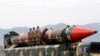 FILE - Pakistani military personnel stand beside a surface-to-surface ballistic missile during a Pakistan Day military parade in Islamabad on March 23, 2019. A White House official said on Dec. 19, 2024, that Pakistan is developing missile capabilities that could reach the U.S.