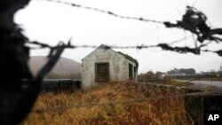 FILE - The old disused border post on the border between the Republic of Ireland and Northern Ireland near Jonesborough, Northern Ireland, Jan. 30, 2017.