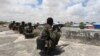 Members of Somali Armed Forces take their position during fighting between the military and police backed by intelligence forces in the Dayniile district of Mogadishu, Sept. 16, 2017. 
