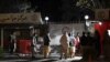 Relatives of blast victims gather outside the Italian aid organization emergency hospital in Kabul on Nov. 7, 2023, following an explosion on a bus.