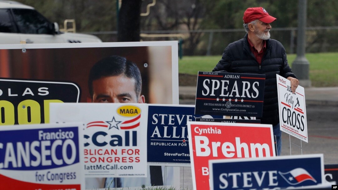 FILE - Election signs in San Antonio, Texas on Feb. 20, 2018. (AP Photo/Eric Gay)