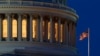 FILE - An American flag flies on the Capitol building in Washington, July 16, 2019. 