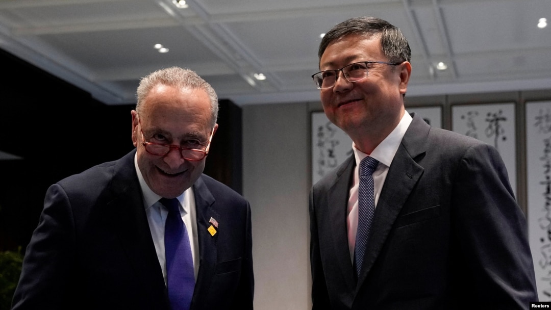 U.S. Senate Majority Leader Chuck Schumer poses with Shanghai Party Secretary Chen Jining in Shanghai on Oct. 7, 2023. 