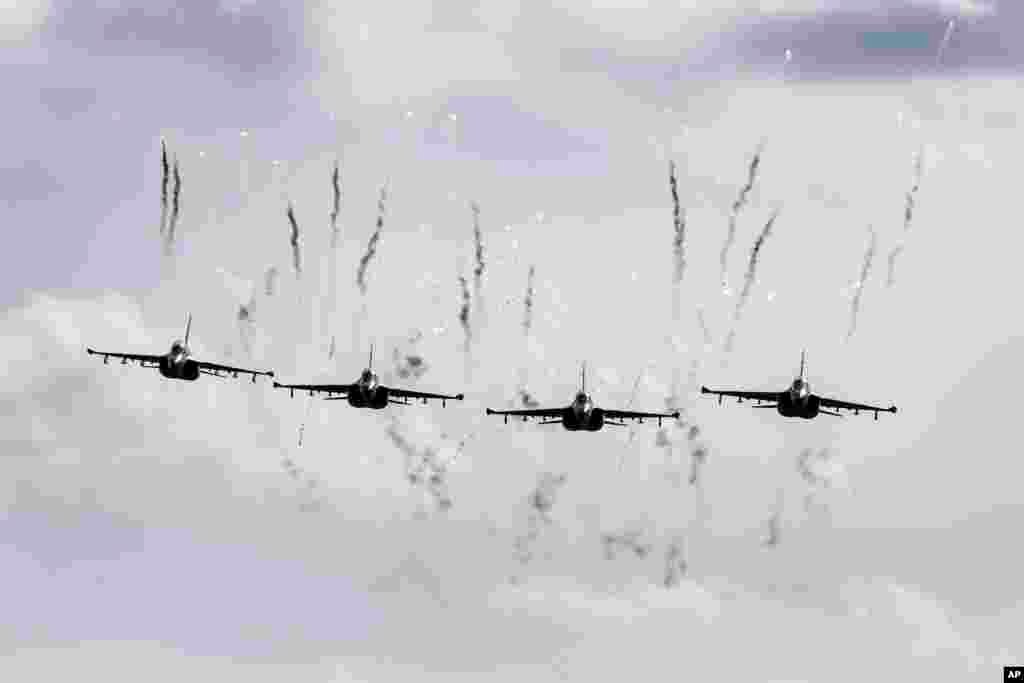Belarusian military jets fly during military exercises, near the Volka village, 200 kilometers (125 miles) south-west of Minsk.