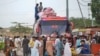 FILE - Afghan refugees board a bus from Karachi, Pakistan, to Afghanistan on Sept. 21, 2023. Afghans have poured into Pakistan by the millions during decades of successive wars. Pakistani officials on Oct. 3, 2023, ordered undocumented immigrants to leave the country by Nov. 1.