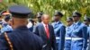 Kenyan President Uhuru Kenyatta inspects a guard of honor as he arrives at the Parliament Building to deliver his state of the nation address in Nairobi, March 27, 2014. 