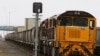 FILE - An empty coal train sits on the tracks at the Port of Brisbane, Jan. 15, 2011.