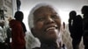 Giant photographs of former president Nelson Mandela at the Nelson Mandela Legacy Exhibition, Cape Town, June 27, 2013.