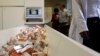 A newly mechanized pharmaceutical machine that helps pharmacists dispense medicine is loaded with ARV medication, at the U.S. sponsored Themba Lethu, HIV/AIDS Clinic, at the Helen Joseph hospital, in Johannesburg, South Africa, Nov. 15, 2012.