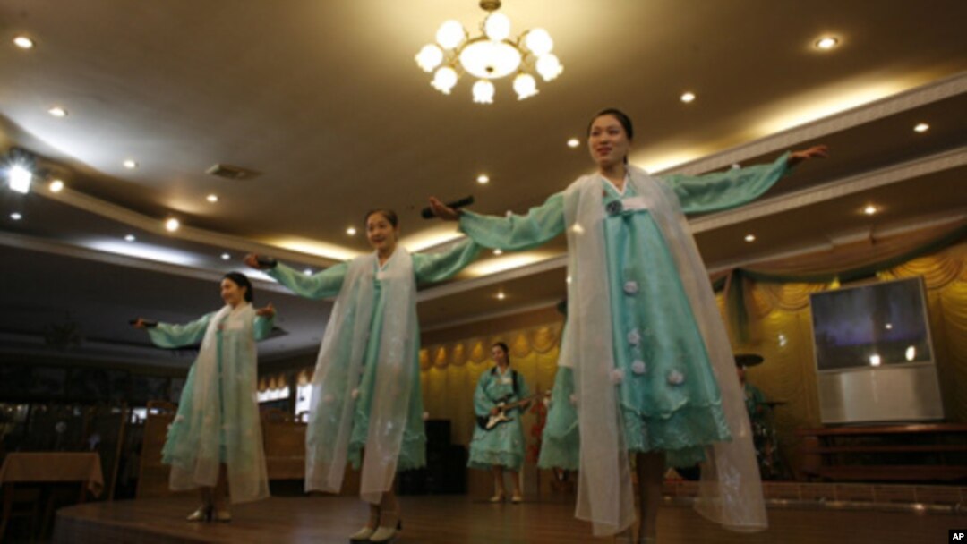 Waitresses not only serve food, they also put on musical performance for the customers in the Pyongyang Restaurant.