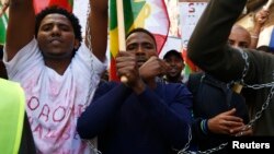Ethiopian migrants, all members of the Oromo community of Ethiopia living in Malta, protest in Valletta against the Ethiopian regime's plan to evict Oromo farmers to expand Ethiopia's capital, Addis Ababa, Dec. 21, 2015.
