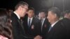 This handout photograph taken and released by Serbia's Presidential press service on May 7, 2024, shows Serbian President Aleksandar Vucic shaking hands with Chinese President Xi Jinping during a welcoming ceremony at Belgrade Airport.