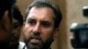 FILE - Samiullah Afridi, lawyer for Shakil Afridi, who ran a fake vaccination campaign to try help U.S. officials find al-Qaida chief Osama bin Laden, speaks to the media after appearing before the court in Peshawar.