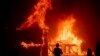 A home burns as the Camp Fire rages through Paradise, Calif., on Nov. 8, 2018. 
