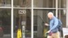 A man walks past a Washington office building housing Iran's Interests Section at 1250 23rd Street NW, April 25, 2018 (VOA Persian)