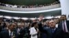 Turkish President Recep Tayyip Erdogan greets members of parliament from his ruling AK Party during a meeting in Ankara, April 24, 2018. 