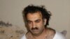 FILE - Khalid Sheikh Mohammed is seen after his capture, March 1, 2003, in this photo obtained by the Associated Press. On Tuesday, the Biden administration asked a federal appeals court to block a plea agreement for the accused mastermind of the Sept. 11, 2001, attacks.