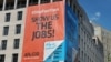 Banners declaring opposition to President Barack Obama's efforts to get trade legislation passed are seen on the headquarters of the American Federation of Labor-Congress of Industrial Organizations in Washington, June 12, 2015.