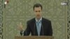 An image grab taken from the state-run Syrian news channel shows on July 16, 2014 Syrian President Bashar al-Assad delivering a speech during a swearing-in ceremony at the presidential palace in Damascus. 