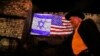 A picture taken on Dec. 6, 2017, shows a giant U.S. flag screened alongside Israel's national flag by the Jerusalem municipality on the walls of the old city.