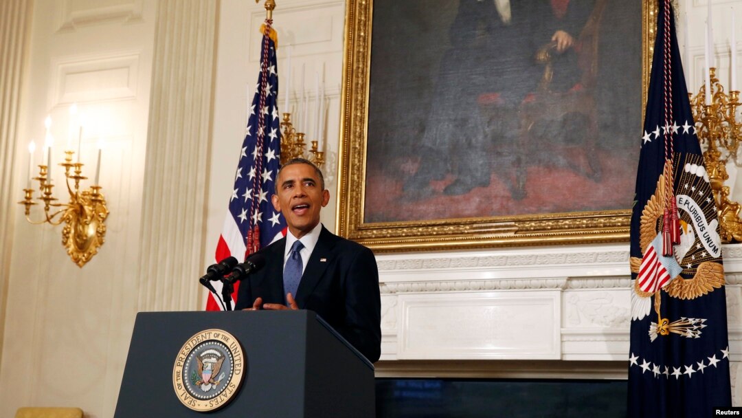 U.S. President Barack Obama talks about the humanitarian relief situation in Iraq inside the State Dining Room of the White House in Washington, August 7, 2014.