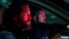 This image released by Lionsgate shows Gerard Butler, left, and O'Shea Jackson Jr. in a scene from "Den of Thieves 2: Pantera." (Rico Torres/Lionsgate via AP)
