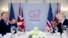 President Donald Trump, left, and Britain's Prime Minister Boris Johnson attend a working breakfast on the sidelines of the G-7 summit in Biarritz, France, Aug. 25, 2019.