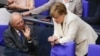 German Chancellor Angela Merkel, right, talks with Finance Minister Wolfgang Schaeuble prior to a debate about the British vote to leave the EU, in Berlin, June 28, 2016.