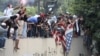 Protesters destroy an American flag pulled down from the U.S. Embassy in Cairo, Egypt, Sept. 11, 2012.