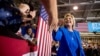 Democratic presidential candidate Hillary Clinton greets a member of the audience as she arrives to speak at a rally at Johnson C. Smith University in Charlotte, N.C., Sept. 8, 2016.