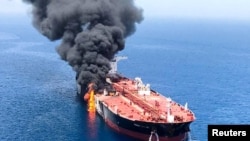An oil tanker is seen after it was attacked at the Gulf of Oman, June 13, 2019.