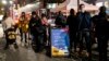 FILE - People wait to receive a COVID-19 vaccine booster shot at a mobile vaccination site near Central Park in New York City, Dec. 2, 2021. 