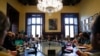 President of the Catalan parliament Carme Forcadell, center, sits with parliament representatives to discuss their next move after Spanish government announced plans to remove members of the region's pro-independence government, at the Catalonia Parliament in Barcelona, Oct. 23, 2017.