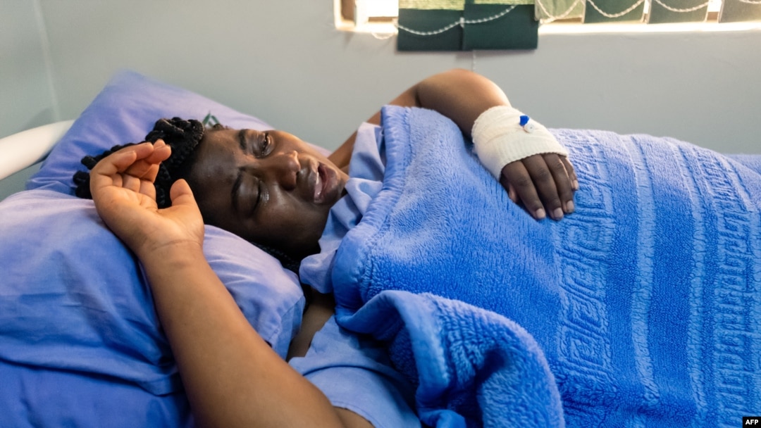 FILE - Zimbabwean activist Joana Mamombe lies hospitalized in Harare on May 15, 2020, after allegedly being abducted and beaten by police and eventually dumped along a road some distance from the capital.