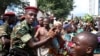 People greet soldiers as they celebrate in Bujumbura, Burundi, May 13, 2015.