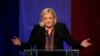 Far right National Front party leader Marine Le Pen delivers a speech after the announcement of partial results in the second round of regional elections, in Henin-Beaumont, northern France, Dec.13, 2015.