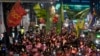 FILE - Protesters march to the presidential office after a candlelight vigil against South Korean President Yoon Suk Yeol in Seoul, South Korea, Dec. 5, 2024.