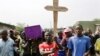 Hundreds gather for the funeral procession of Emmanuel Ndere Yimana, an opposition supporter assassinated Wednesday, in Bujumbura, Burundi, July 22, 2015. 