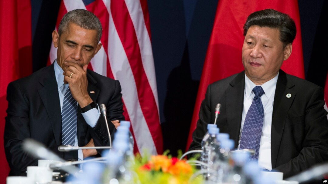 FILE - U.S. President Barack Obama, left, has directly discussed concerns about China's pending anti-terrorism law with the country's leader, Xi Jinping. They're shown during a meeting in Paris, Nov. 30, 2015. 