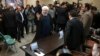 Iranian President Hassan Rouhani waves to media as he arrives at the Interior Ministry to register his candidacy for the May 19 presidential elections, in Tehran, Iran, April 14, 2017