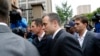 Oscar Pistorius arrives at court for the third day of his trial for the murder of his girlfriend Reeva Steenkamp at the North Gauteng High Court in Pretoria, March 5, 2014.