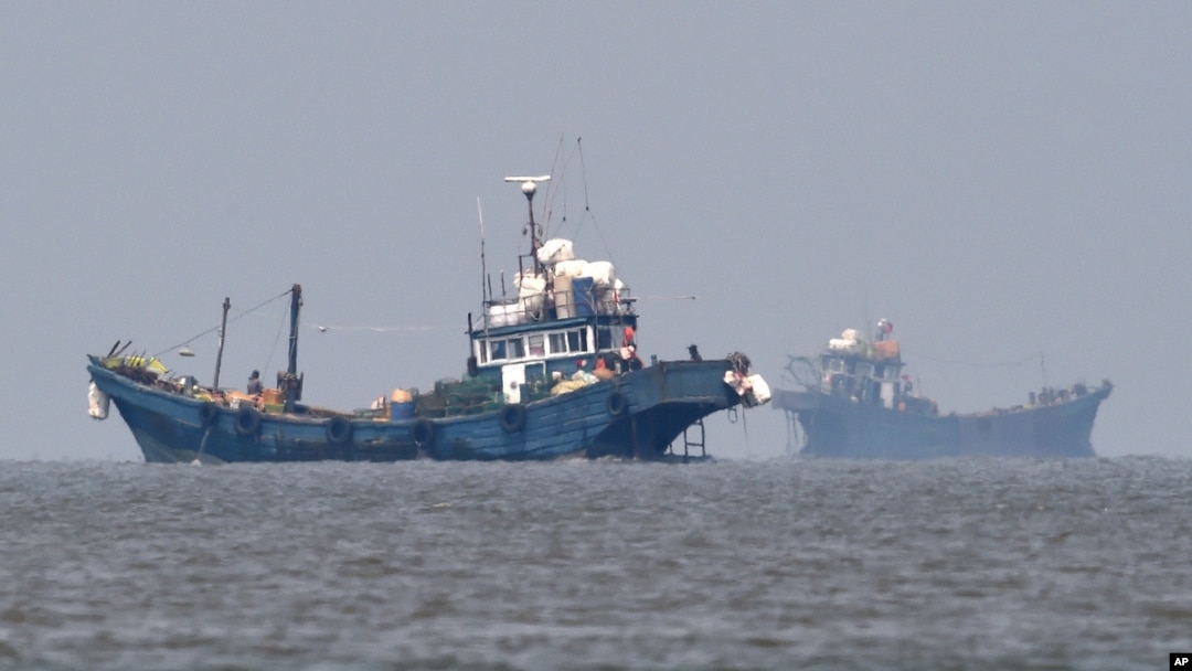 FILE - In this photo provided by the South Korean Defense Ministry, Chinese fishing boats are seen in neutral waters around Ganghwa island, South Korea, June 10, 2016. 